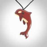 Stained Bone and natural bone orca. Hand carved pendant made by NZ Pacific. Hand carved Bone orca necklace hand made by Yuri Terenyi.